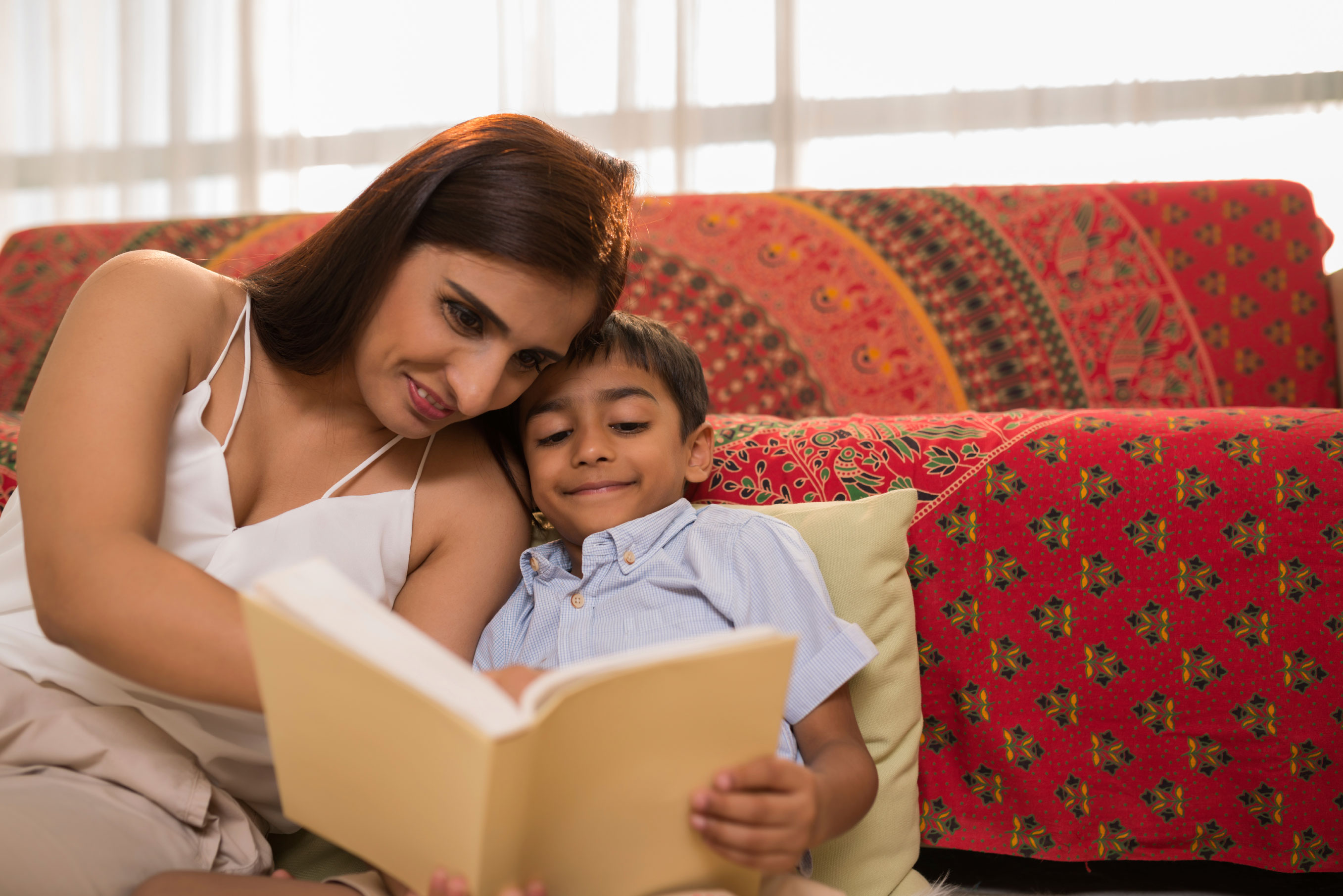 Mum reading to her boy