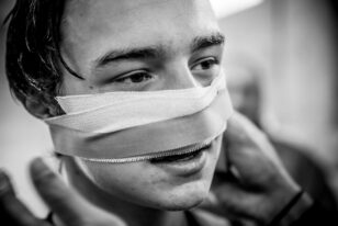 Boy with bandage on his head